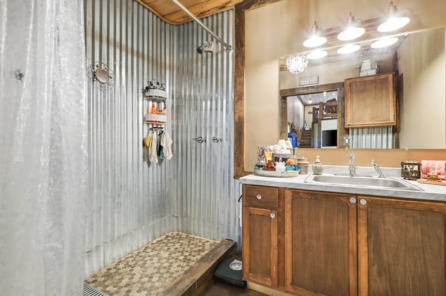 bathroom with vanity and walk in shower