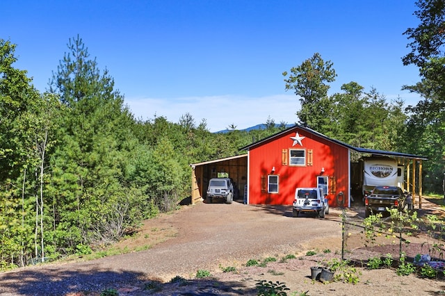 view of outbuilding with a carport