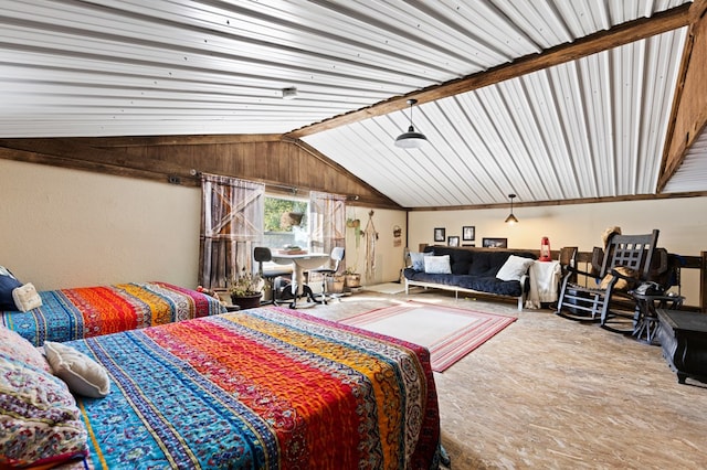 bedroom featuring lofted ceiling and carpet