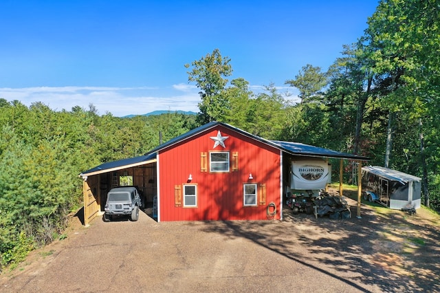 view of outdoor structure with a carport