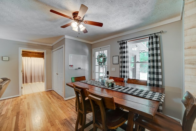 dining room with ceiling fan, light hardwood / wood-style flooring, and ornamental molding