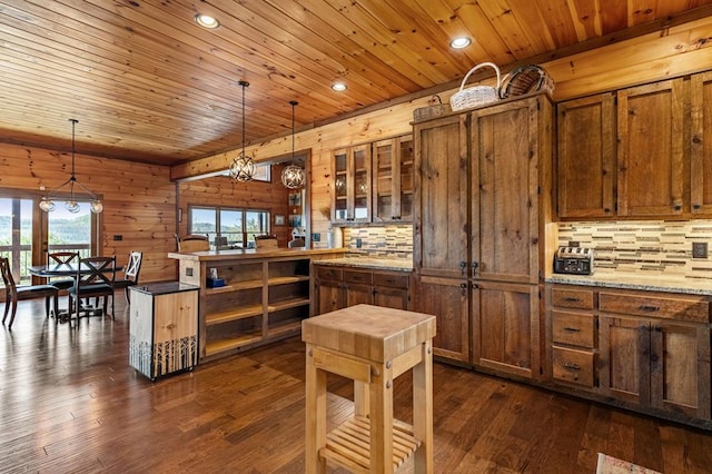 kitchen with tasteful backsplash, brown cabinetry, wooden ceiling, and dark wood-type flooring