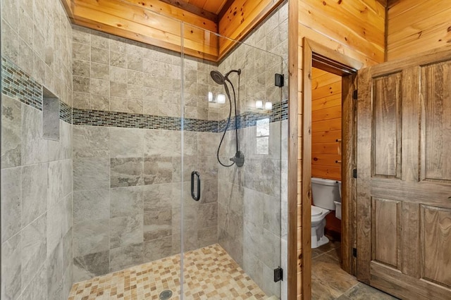 full bathroom with toilet and a stall shower