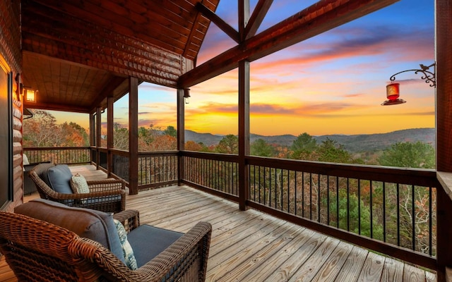 deck at dusk with a mountain view