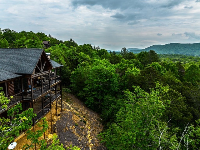 exterior space with a wooded view