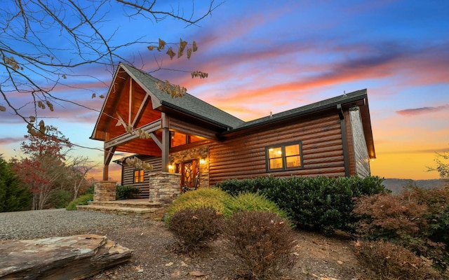 exterior space with log veneer siding