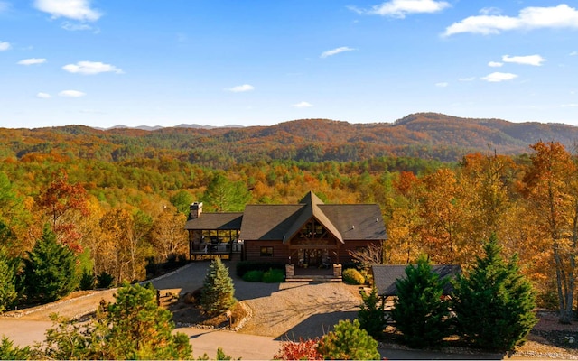 exterior space with a wooded view