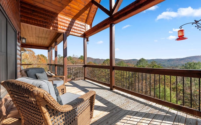 wooden terrace featuring a mountain view