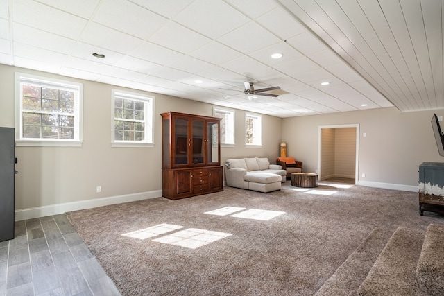 living room with wood finished floors, a ceiling fan, recessed lighting, and baseboards