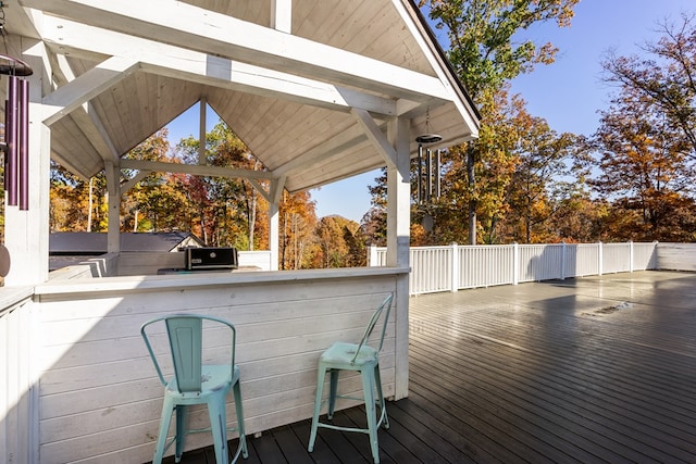 deck with an outdoor bar and a gazebo