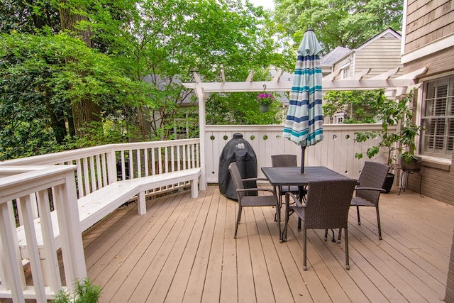 wooden terrace featuring outdoor dining area