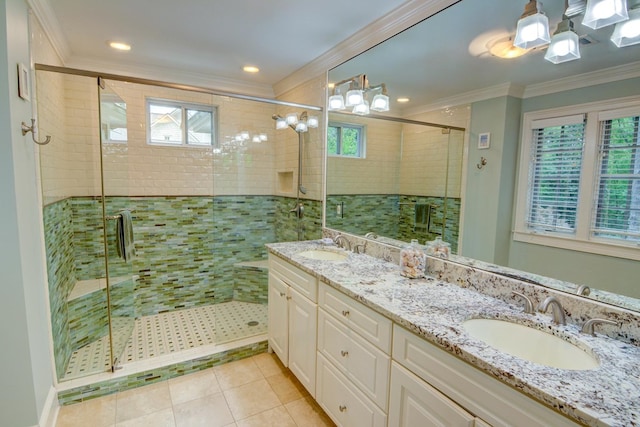 bathroom featuring crown molding, plenty of natural light, and a sink