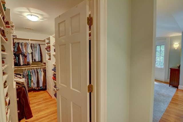 walk in closet with light wood-style floors and visible vents