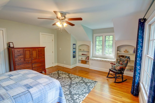 bedroom featuring baseboards, a ceiling fan, and wood finished floors