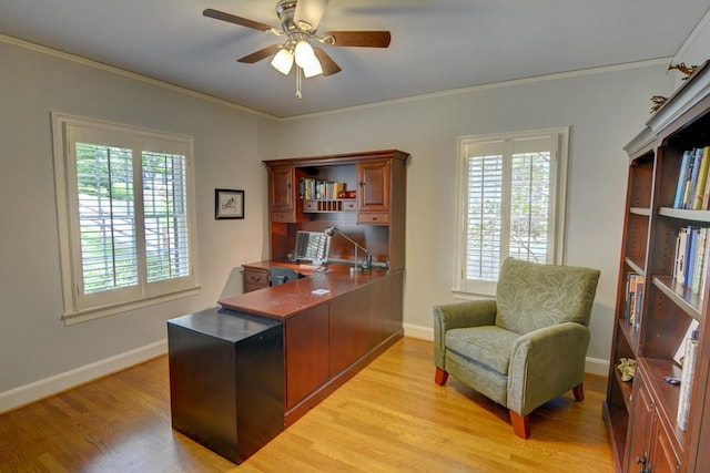 office with crown molding, a ceiling fan, light wood-style flooring, and baseboards