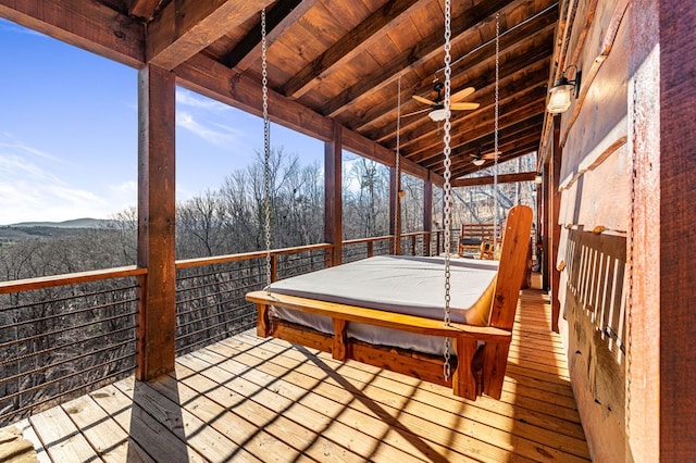 deck featuring a covered hot tub and ceiling fan