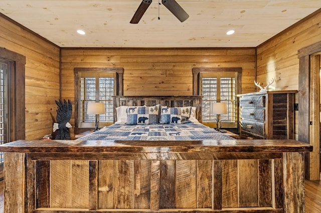 unfurnished bedroom featuring ceiling fan, wooden ceiling, and multiple windows