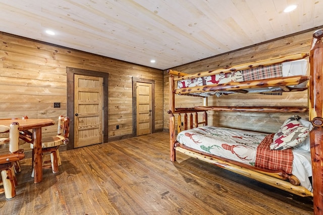 bedroom with wood ceiling and hardwood / wood-style floors