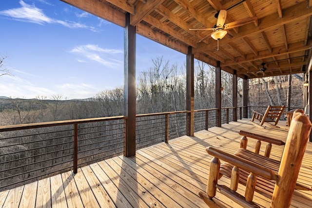 wooden terrace featuring ceiling fan