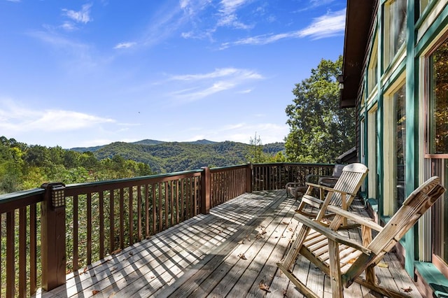 wooden deck featuring a mountain view