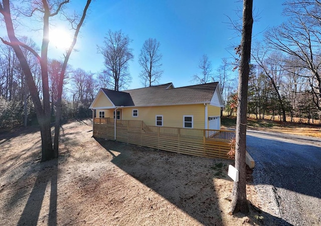 view of side of property with a garage