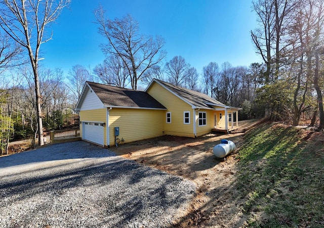 view of side of property with a garage