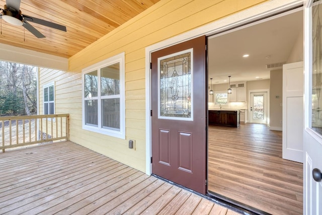 exterior space featuring ceiling fan