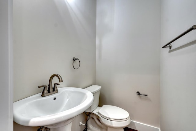 bathroom with sink and toilet