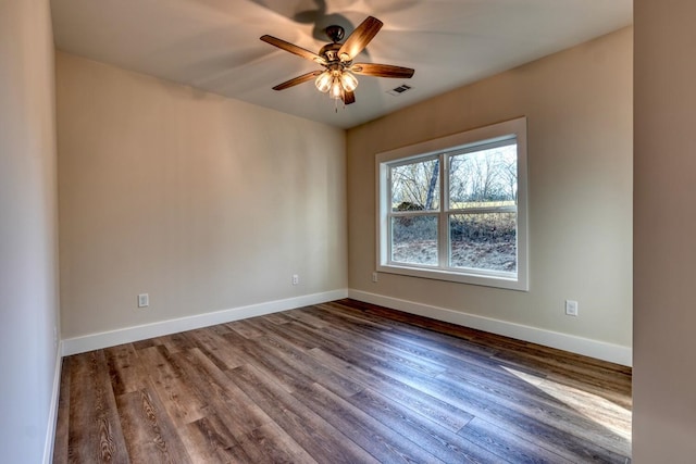 empty room with ceiling fan and wood-type flooring