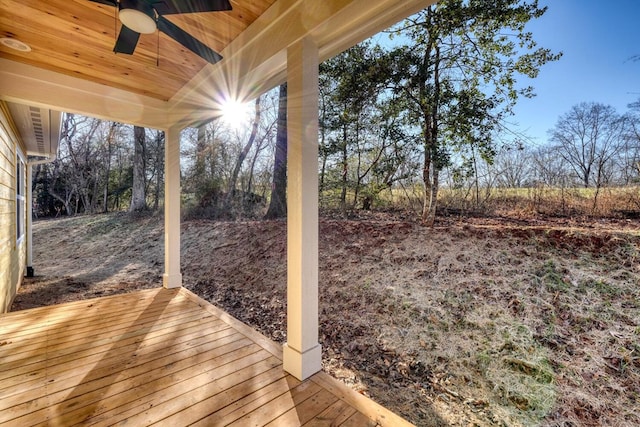 wooden deck featuring ceiling fan