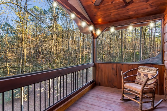 sunroom with vaulted ceiling and wooden ceiling