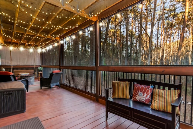 sunroom featuring wood ceiling