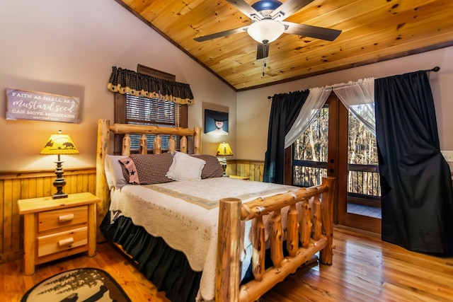 bedroom featuring ceiling fan, vaulted ceiling, access to outside, wood-type flooring, and wooden ceiling