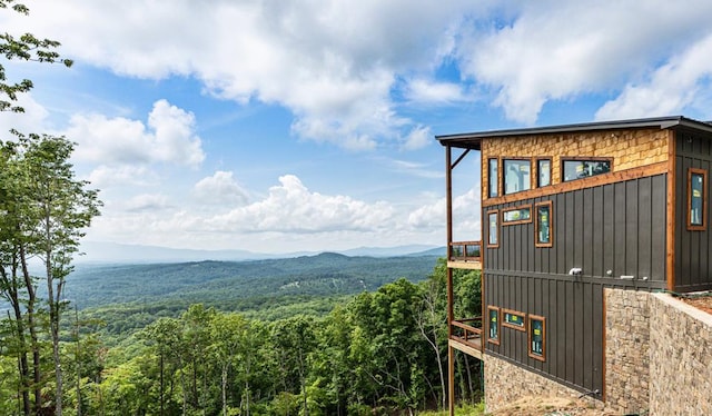 view of side of home featuring a mountain view