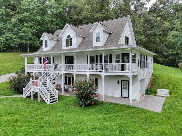 exterior space featuring a garage, a porch, and a lawn