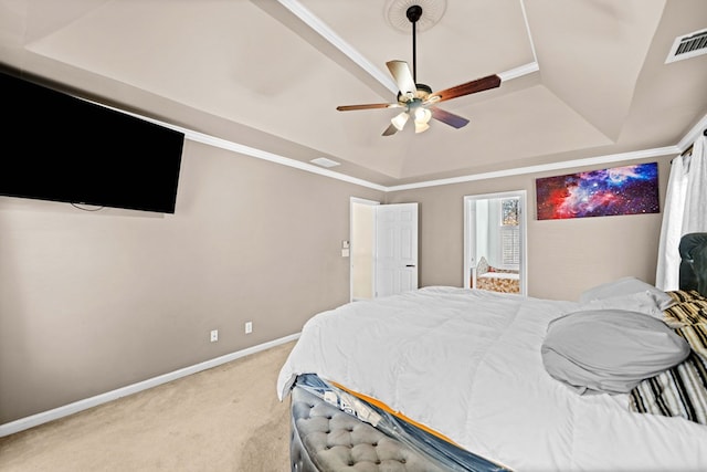 bedroom with baseboards, visible vents, light colored carpet, ceiling fan, and a tray ceiling