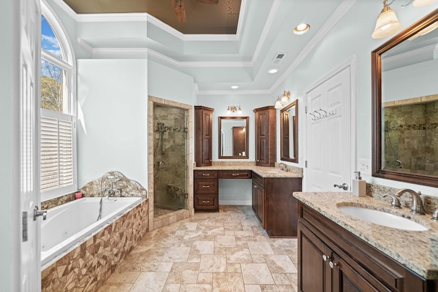 bathroom with crown molding, visible vents, a stall shower, a sink, and a jetted tub