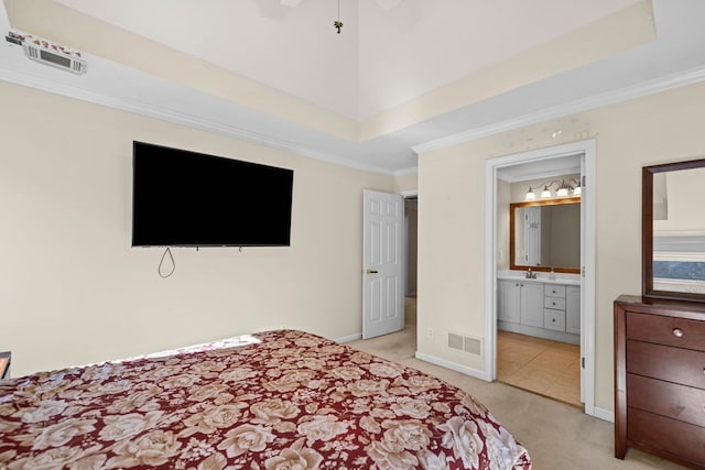 bedroom featuring light carpet, visible vents, baseboards, ornamental molding, and a tray ceiling