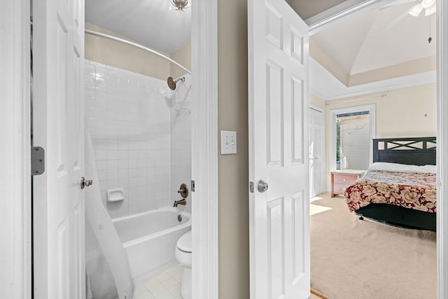 full bathroom with shower / bathtub combination, lofted ceiling, toilet, and connected bathroom