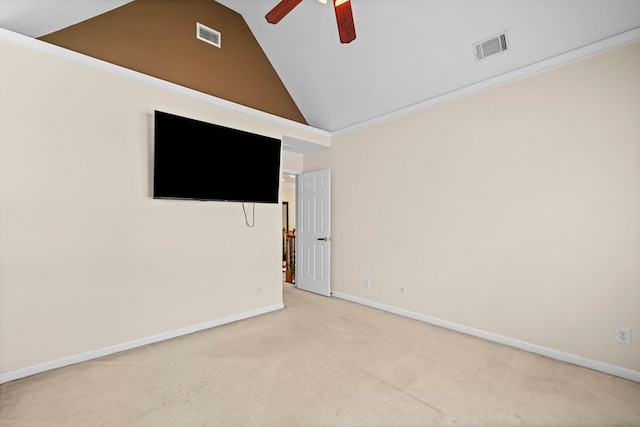 carpeted empty room featuring high vaulted ceiling, baseboards, visible vents, and a ceiling fan