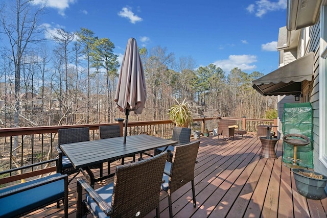 wooden deck with outdoor dining area