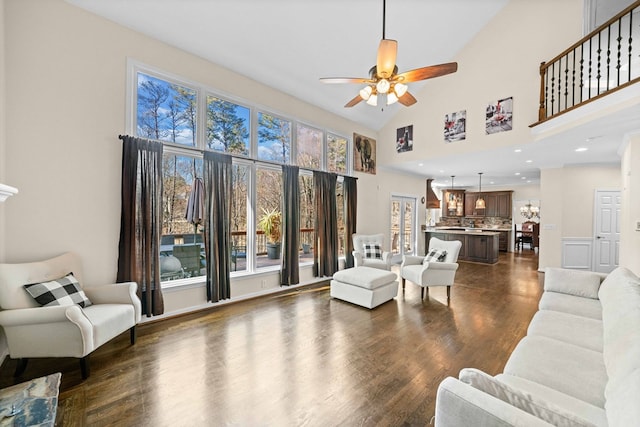 living room with high vaulted ceiling, a ceiling fan, dark wood-type flooring, and recessed lighting