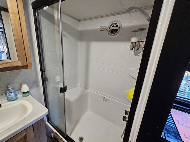 bathroom with vanity and an enclosed shower