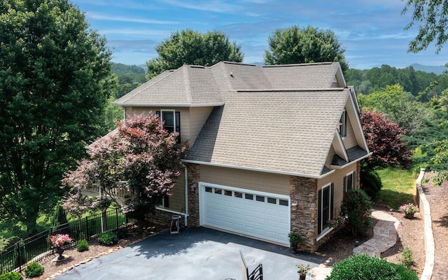 115 Country Club Vw, Hayesville, NC 28904 - view of side of home featuring stone siding, asphalt driveway, roof with shingles, and an attached garage