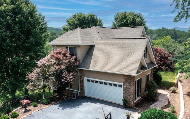 view of side of home featuring a garage