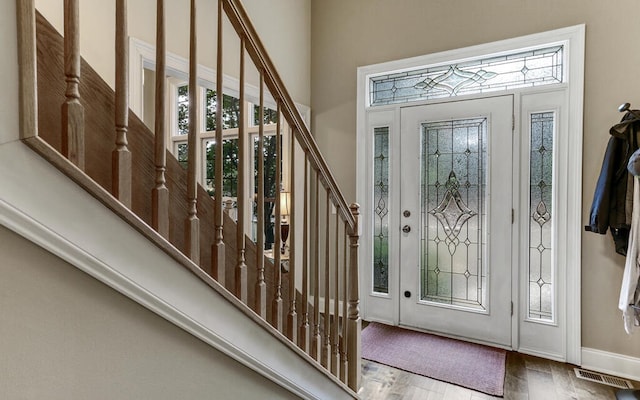 foyer entrance featuring hardwood / wood-style flooring