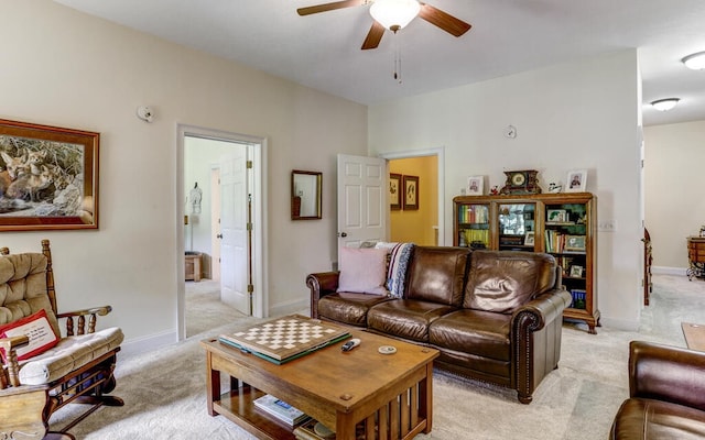 living room featuring light carpet and ceiling fan