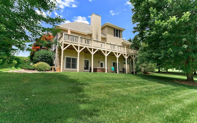 rear view of property featuring a yard