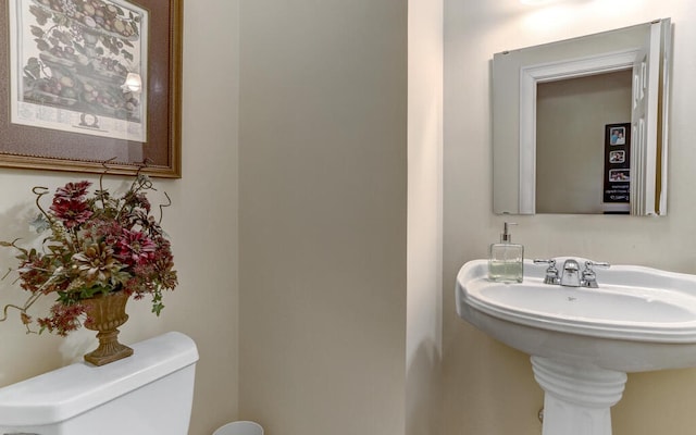 bathroom with toilet and sink