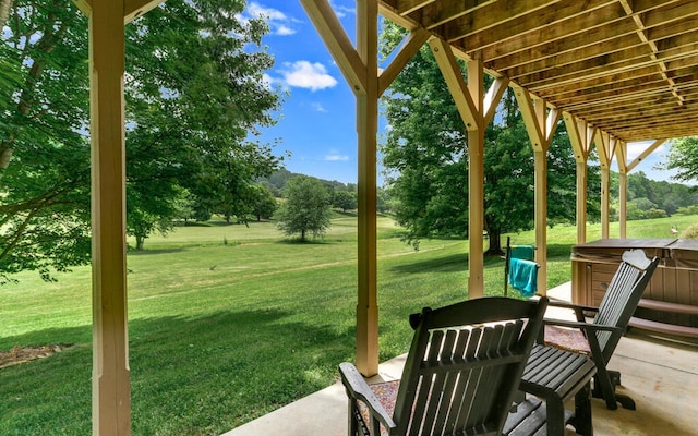 view of yard with a hot tub and a patio